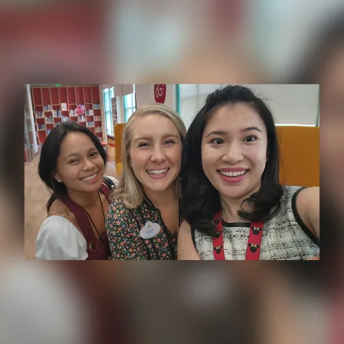 A selfie with two Disney colleagues, cast-member name badges visible.