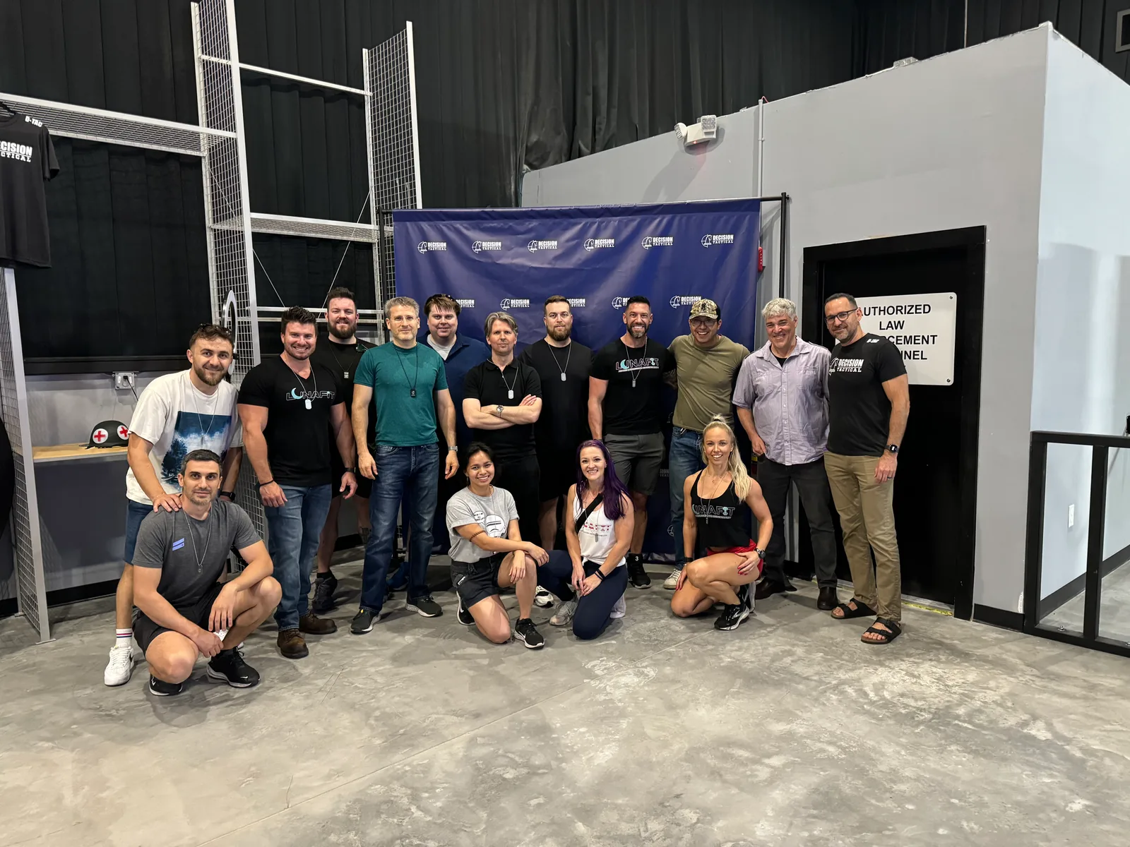 The LunaFit team posed together at a company offsite in branded shirts.
